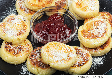 Tasty cottage cheese pancakes, Syrniki. 121997666