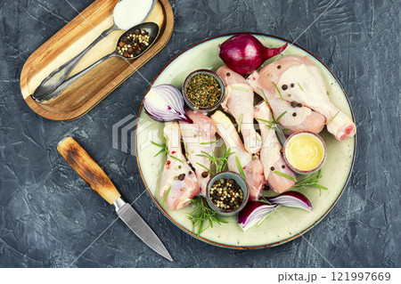 Uncooked raw chicken legs. 121997669