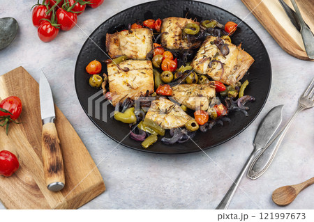 Fish fillet and baked vegetables. Fish fillet and baked vegetables. 121997673