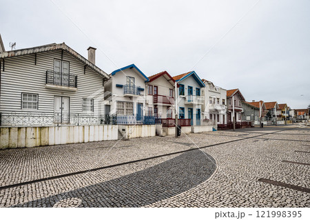 Street with colorful houses. Street with striped houses, Costa Nova, Aveiro, Portugal Street with colorful houses. Street with striped houses, Costa Nova, Aveiro, Portugal 121998395