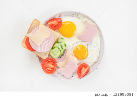 Funny breakfast toast for kids. Creative children's sandwich and cute fried eggs. Baby food menu. Breakfast for children Funny breakfast toast for kids. Creative children's sandwich and cute fried eggs. Baby food menu. Breakfast for children 121999081