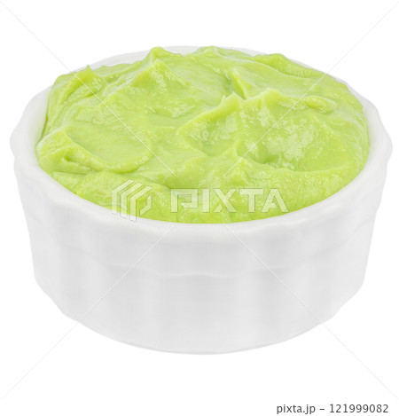 Bowl with guacamole cream pure made of ripe avocado isolated on white background 121999082