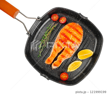 grilled salmon steak on grill pan on white background, Roasted Salmon Fillet Steak in a pan. top view grilled salmon steak on grill pan on white background, Roasted Salmon Fillet Steak in a pan. top view 121999199