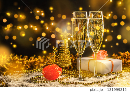 Elegant glass of champagne with red caviar Gourmet food on Festive background with bokeh. New Year and Merry Christmas concept. copy space Elegant glass of champagne with red caviar Gourmet food on Festive background with bokeh. New Year and Merry Christmas concept. copy space 121999213