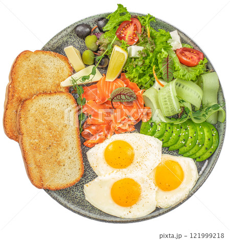 Plate of breakfast with salmon, sunny side eggs, avocado and vegetable salad isolated on white background. top view 121999218