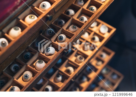 Wooden drawers filled with prosthetic eyeballs Wooden drawers filled with prosthetic eyeballs 121999646