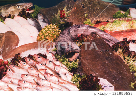 Fresh seafood assortment displayed on ice Fresh seafood assortment displayed on ice 121999655