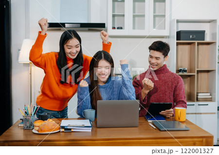Office worker lifestyle people. business team successful calculating expenses and using laptop. Home office. Work place. Lifestyle. 122001327