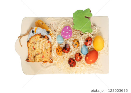 Easter cake, cookies and painted eggs in ceramic tray. Isolate on a white background. Easter traditions. Variety of homemade foods. Country style. Easter cake, cookies and painted eggs in ceramic tray. Isolate on a white background. Easter traditions. Variety of homemade foods. Country style. 122003656