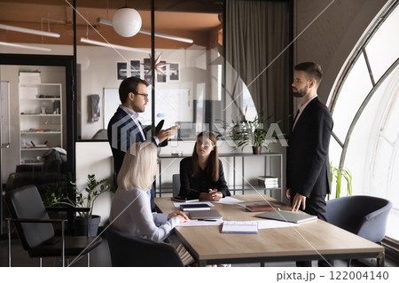 Project managers leaders speaking in conference room Project managers leaders speaking in conference room 122004140