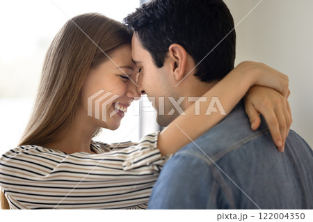 Happy young couple in love hugging with noses touch 122004350