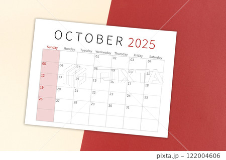 October 2025 calendar page on yellow and red background. 122004606