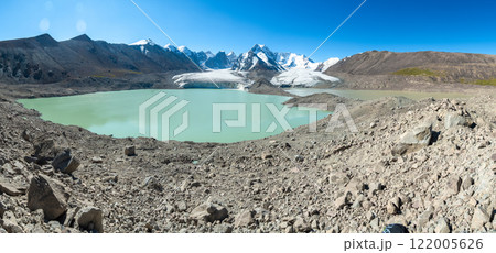 Panorama of the foothills of Mount Kyzylasker, a glacier with a moraine blue lake in the highlands. Ancient arctic large glacier in sunny weather Panorama of the foothills of Mount Kyzylasker, a glacier with a moraine blue lake in the highlands. Ancient arctic large glacier in sunny weather 122005626
