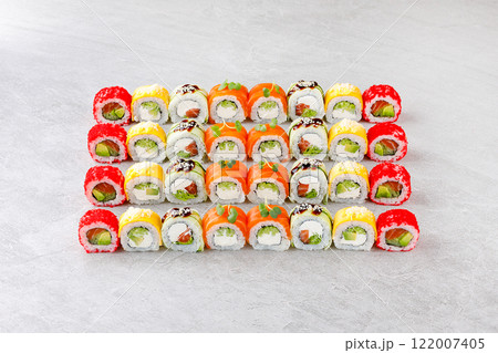 Japanese sushi rolls, sushi sets on a gray background for restaurant menu and food delivery 122007405
