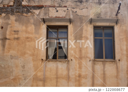 Old house with two windows, Cefalu, Sicily, Italy 122008677