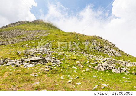 fagaras mountain ridge. fresh air. beautiful summer landscape of romania. sunny day. green rocky cliffs. majestic nature background. steep slope of transylvania alps fagaras mountain ridge. fresh air. beautiful summer landscape of romania. sunny day. green rocky cliffs. majestic nature background. steep slope of transylvania alps 122009000