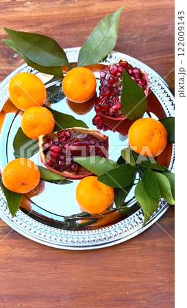 Organic fruits styled with vibrant tones reflect healthy lifestyle harmony. Fresh citrus, juicy fruits, wholesome energy, natural simplicity, and organic vitality create refreshing balance. 122009143