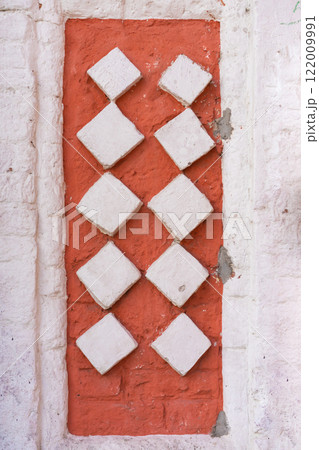Wall Decoration Featuring Six White Circles on a Red Brick Background 122009991
