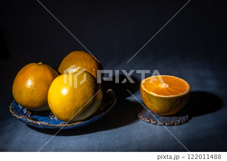 fresh orange wedges in a bowl. Healthy snack. 122011488