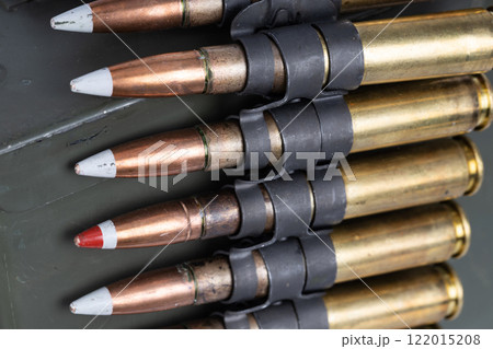 .50 BMG caliber machine gun ammunition belt with cartridges in ammunition can. 122015208