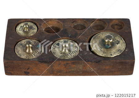 Vintage wooden box with scale weights set on white Vintage wooden box with scale weights set on white 122015217