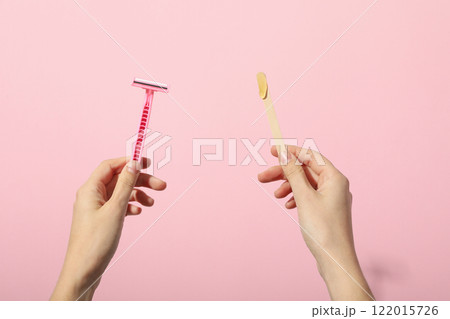 Razor for shaving on a pink background 122015726