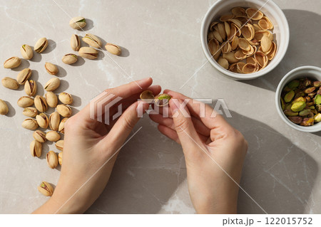 Pistachios in a glass plate, top view. Pistachios in a glass plate, top view. 122015752