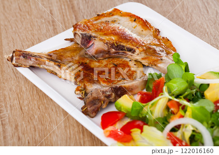 Grilled pork chop with salad Grilled pork chop with salad 122016160