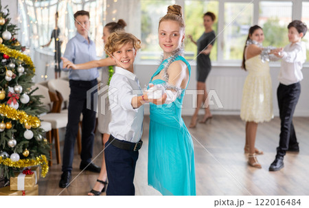 Boy and girl dancing waltz in studio 122016484