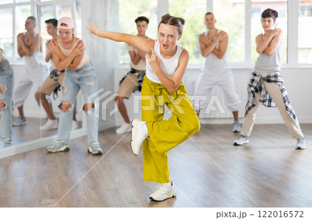 Teenage girl dancing hip hop in group Teenage girl dancing hip hop in group 122016572