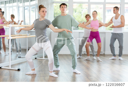 Ballet training for teenagers in a ballet studio under the guidance of choreographer 122016607