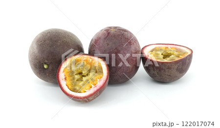 Fresh passion fruits showing pulp and seeds on white background 122017074