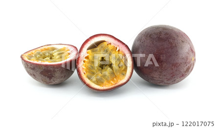 Fresh passion fruits showing the pulp and seeds on white background 122017075