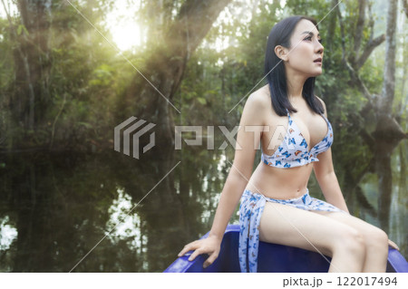 beautiful girl on the boat in the forrest beautiful girl on the boat in the forrest 122017494
