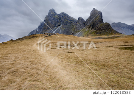 Panoramic view of meadow field with mountain on Estrahorn, Iceland. Nature, travel, winter background, or wallpaper 122018588