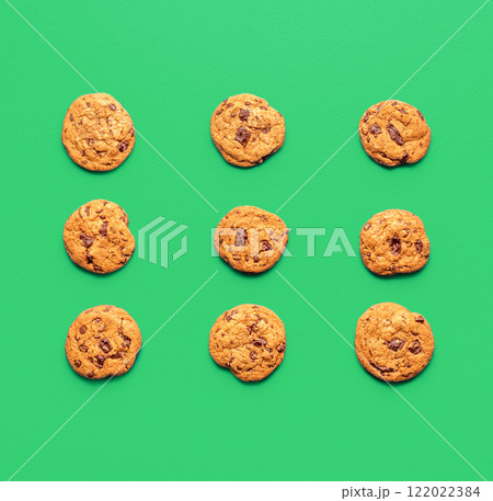 Chocolate chip cookies minimalist on a green background, above view 122022384