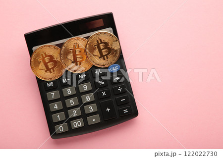 Bitcoin coin and cash with calculator on pink background. Bitcoin growthand investment concept. Bitcoin coin and cash with calculator on pink background. Bitcoin growthand investment concept. 122022730