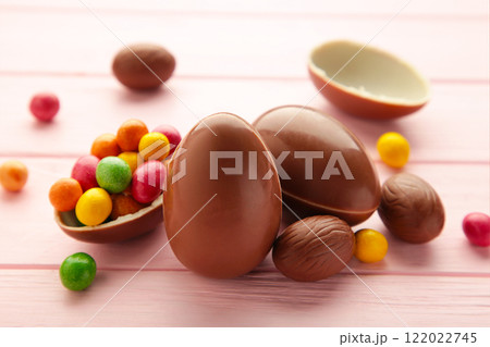 Chocolate easter eggs on wooden pink background. Chocolate easter eggs on wooden pink background. 122022745