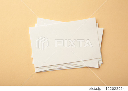 Blank white business cards on beige paper background. Mockup for branding identity. Template for graphic designers portfolios. Blank white business cards on beige paper background. Mockup for branding identity. Template for graphic designers portfolios. 122022924