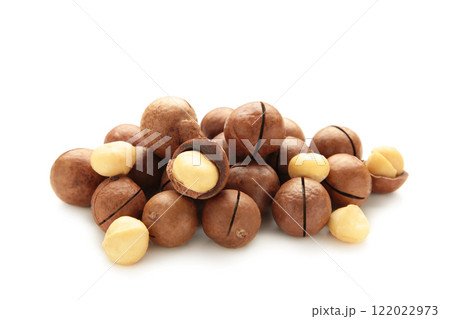 Peeled macadamia nuts. Horizontal composition isolated on white background. Peeled macadamia nuts. Horizontal composition isolated on white background. 122022973