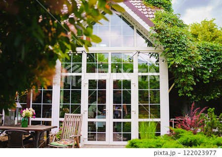 The yard in the house is with panoramic glazing.  122023977