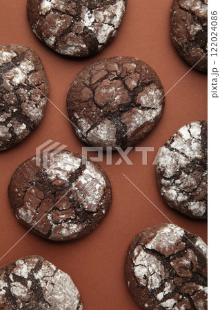 Soft dark chocolate brownie cookies on brown background. Vertical photo Soft dark chocolate brownie cookies on brown background. Vertical photo 122024086