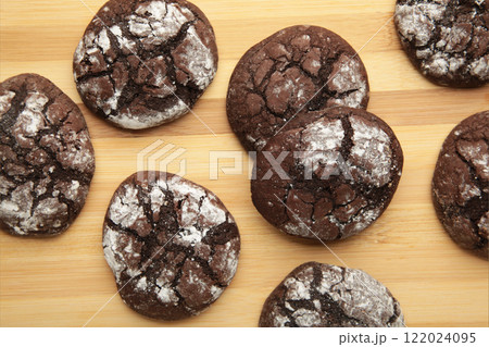 Soft dark chocolate brownie cookies on light background. Vertical photo Soft dark chocolate brownie cookies on light background. Vertical photo 122024095