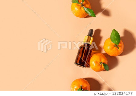 Serum bottle or orange citrus fruit essential oil 122024177
