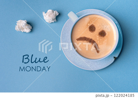 Blue Monday. Unhappy coffee with sad face Blue Monday. Unhappy coffee with sad face 122024185