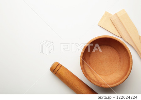 Wooden kitchen utensils on white background. Wooden kitchen utensils on white background. 122024224
