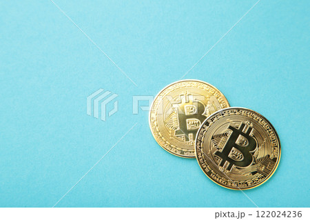 Bitcoin coin and on blue background. Bitcoin growthand investment concept. Bitcoin coin and on blue background. Bitcoin growthand investment concept. 122024236