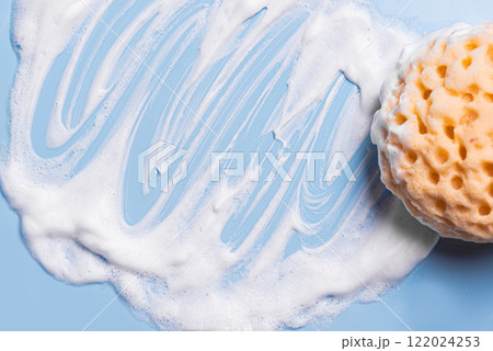 Sponge with foam texture on blue 122024253