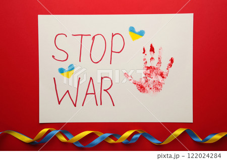 Inscription Stop war with baby handprint on red background, conflict between Ukraine and Russia. No war, stop war, russian aggression. Ukrainian patriot. 122024284