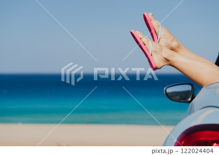 Sexy woman legs against blue sea and sky. Sexy woman legs against blue sea and sky. 122024404